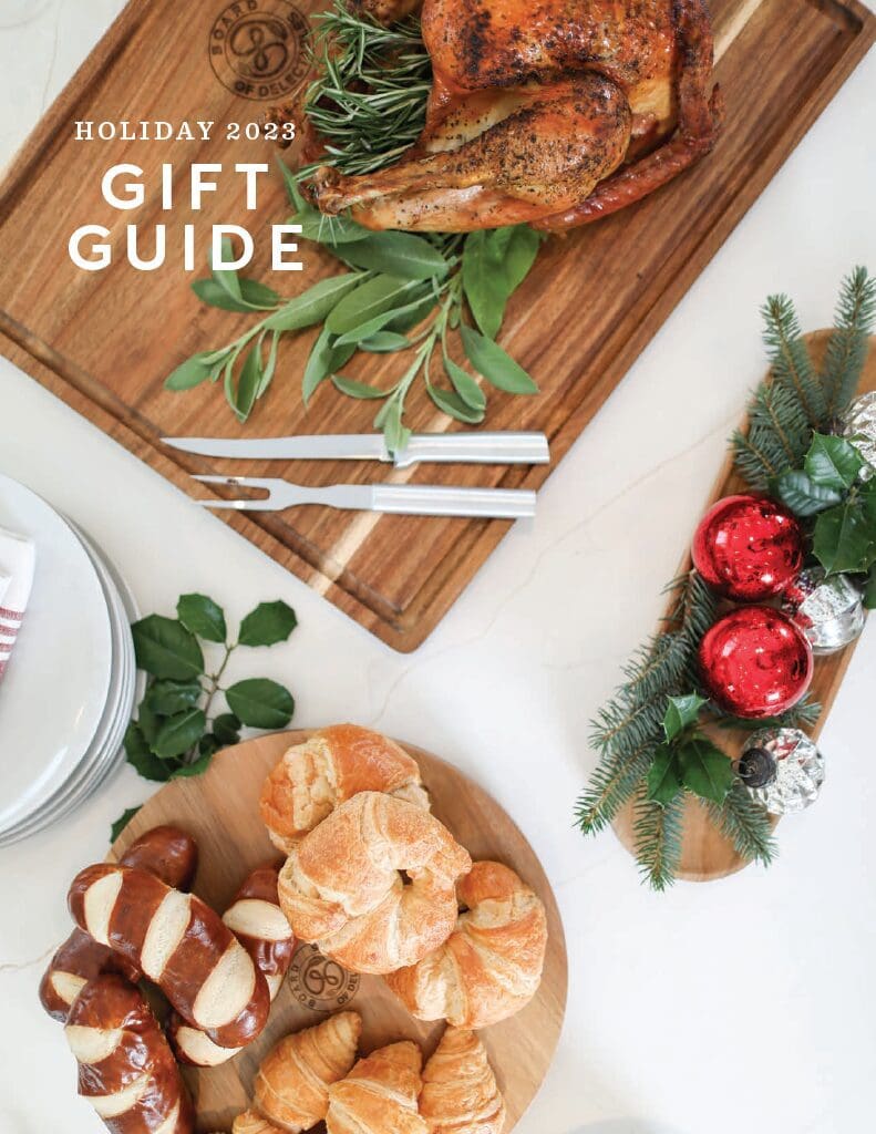 A wooden board with some food on it