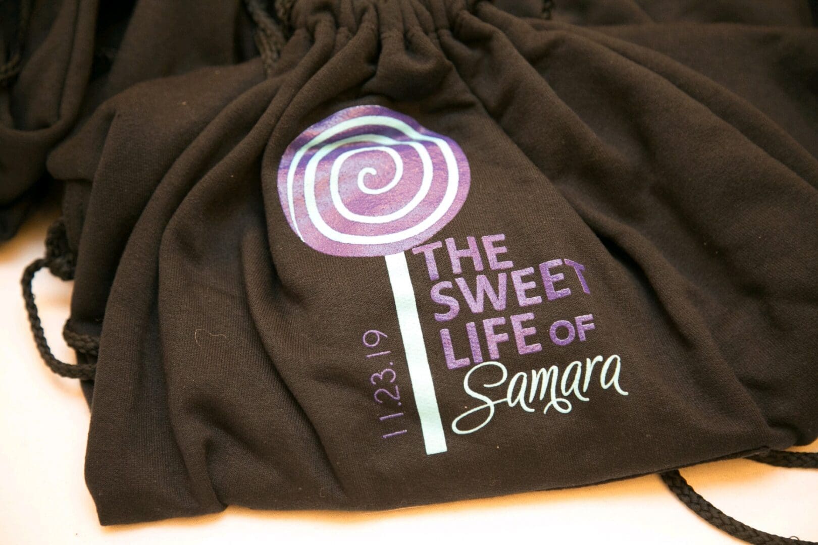 A close up of the back of a bag with a lollipop