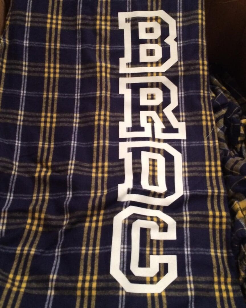 A close up of the letters on a blanket