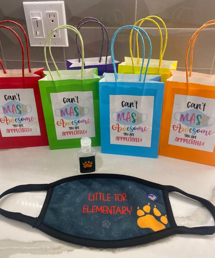 A group of bags with different colors and designs on them.